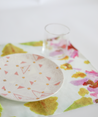 Lime green, pink, red pattern with white background.