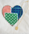 Large Heart Pouch with Gold Necklace that has a "loved charm"