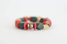 Handmade beaded stretch bracelet with red Ashanti recycled glass disc beads, multi-colored krobo beads, and olive green and gold wood beads
