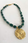 Handmade, short beaded necklace with emerald green Aventurine semi-precious gemstone beads and a gold-plated starburst pendant
