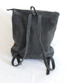 Ethically sourced large suede backpack with sheepskin leather tassel handmade by artisans overcoming poverty in Ethiopia