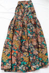 Soft, multicolor floral jewel tone wrap skirt against a navy background