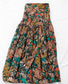 Soft, multicolor floral jewel tone wrap skirt against a navy background