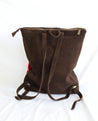 Ethically sourced large suede backpack with sheepskin leather tassel handmade by artisans overcoming poverty in Ethiopia