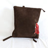 Ethically sourced large suede backpack with sheepskin leather tassel handmade by artisans overcoming poverty in Ethiopia