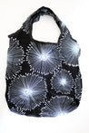 Black tote with luminous blue beam.