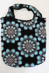 Black tote bag with blue floral patterns sustainable.