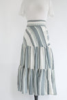 long tiered wrap skirt in multi strip grey and blue
