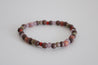 beaded bracelet in purple, deep purple, and multicolors. 