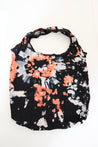 Tie-dye bag with black, orange, and white pattern on a white background.