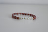 Pink and purple beaded bracelet with the word family