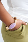 wooden beads bracelet with a big wooden bead in lilac color