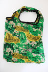 Reusable tote bag in yellow and green print.
