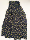 Wrap skirt with black background with neon yellow and purple small repeating floral clusters