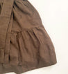 100% cotton wrap brown skirt with subtly brown floral pattern sewn in the USA