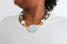 Trendy bohemian necklace with blue and ivory beads, perfect for statement jewelry lovers.