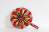 Navy, orange, and red pattern fan