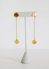 gold pendant with dangling yellow beads