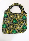 Reusable shopping bag with green and yellow pattern.
