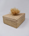 Hand-woven decorative and sustainably storage basket with fun pom pom on top